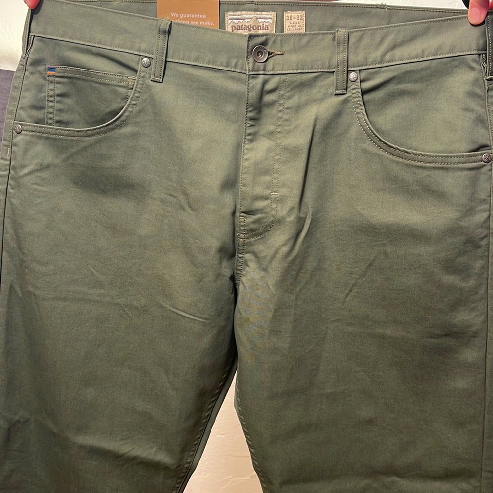 Men’s deep green Patagonia pants.